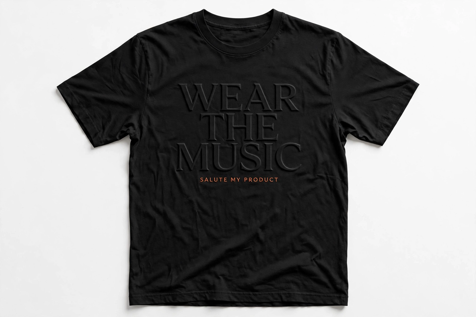 Black T-shirt with tone-on-tone engraved Wear The Music lettering and small orange Salute My Product text